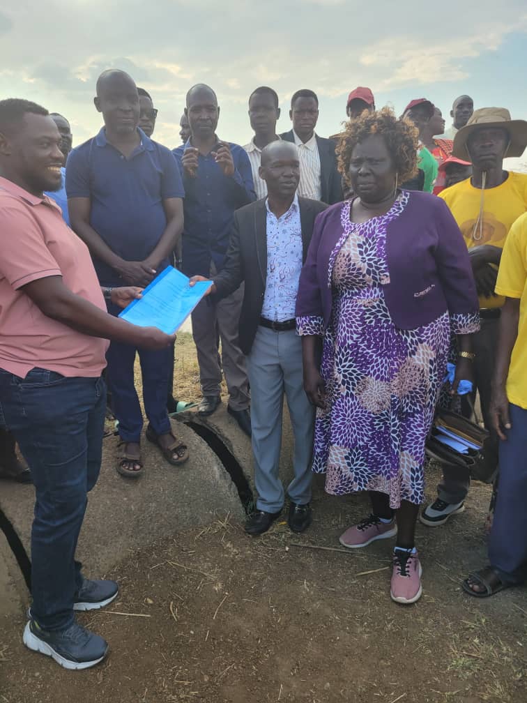 Mr Ojirot Emmy, the deputy RDC of Kapelebyong commissioning the rehabilitation of Acowa - Acinga road as other district leaders look on 23rd January 2024