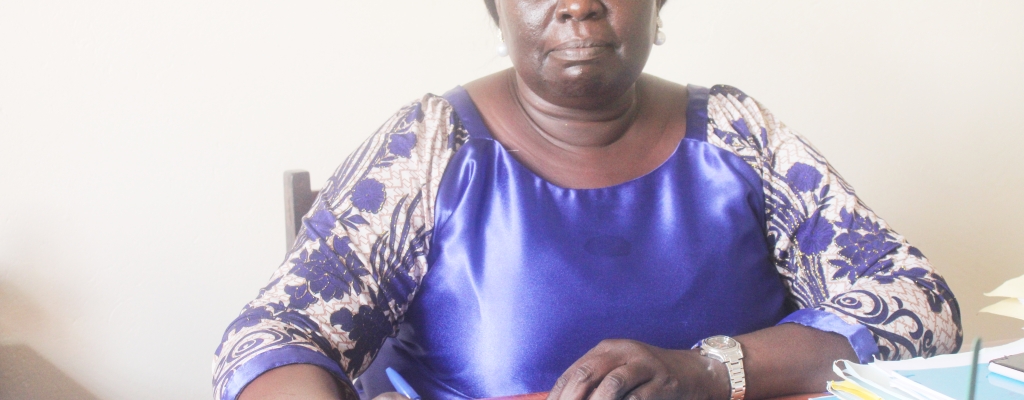 Ms. Oroma Rhoda, the Chief Administrative Officer of Kapelebyong District in her Office