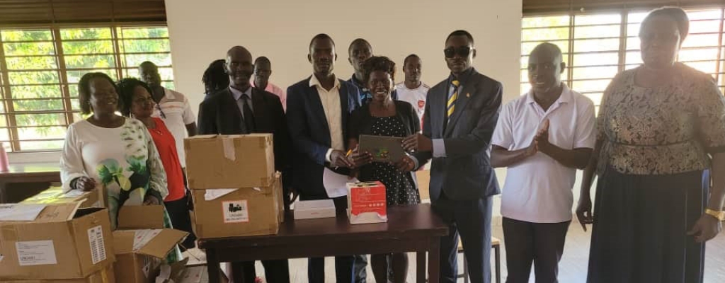 The Ass RDC, Esele Julius (on tie) officiating the distribution of tablets as to selected staff last week. Photo by Emmanuel Opi