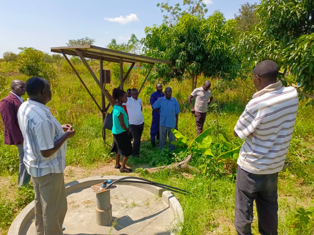Jackson Oculi, explaining to the members of the Production committee of council about his irrigation equipment Jackson Oculi, explaining to the members of the Production committee of council about his irrigation equipment